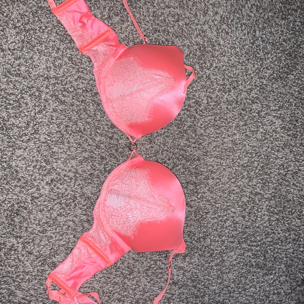 Orange-ish/pink bomb shell VS bra. Used but in good condition.